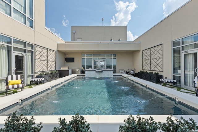 view of swimming pool featuring pool water feature