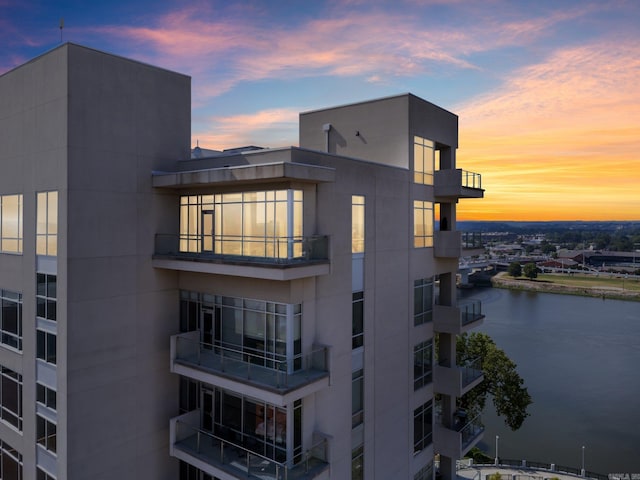 outdoor building at dusk with a water view