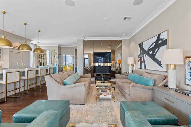 living room featuring dark hardwood / wood-style floors and ornamental molding