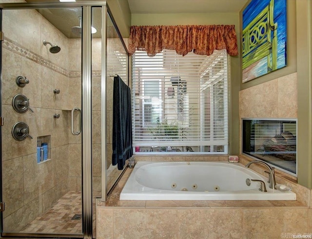 bathroom with separate shower and tub