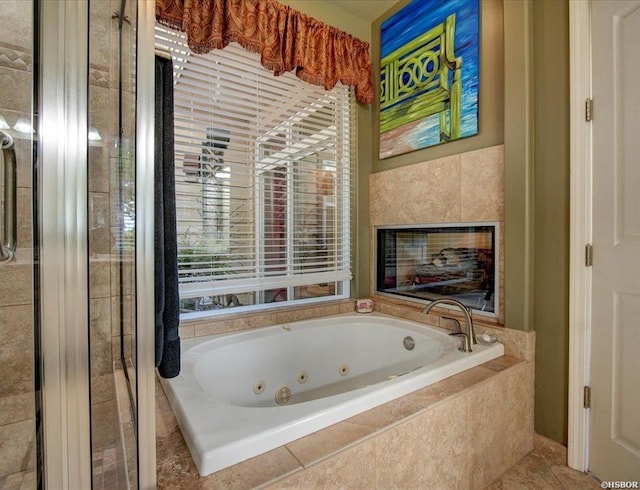 bathroom featuring tiled tub