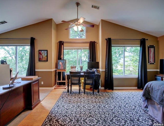 bedroom featuring ceiling fan, vaulted ceiling, and light wood-type flooring