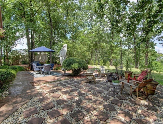 view of patio with an outdoor fire pit