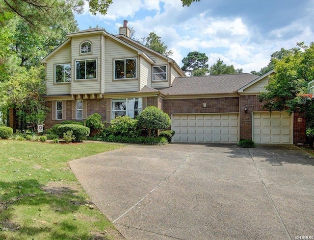 view of property with a garage and a front yard