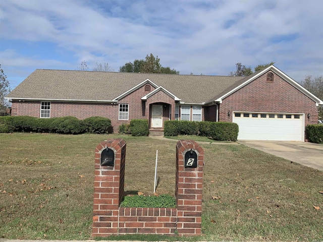 single story home with a front lawn and a garage