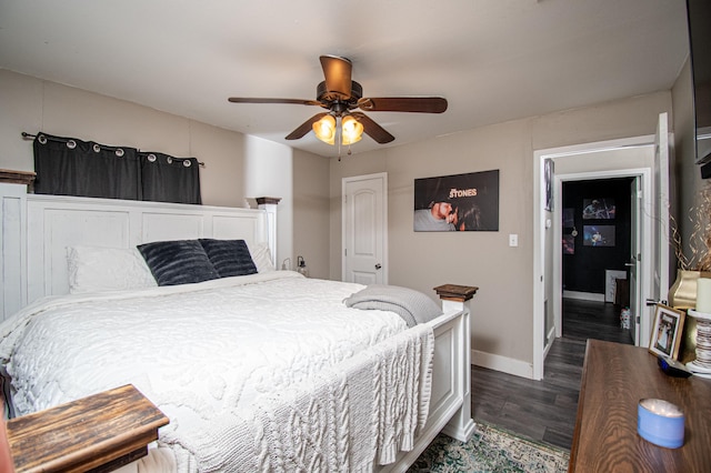 bedroom featuring dark hardwood / wood-style floors and ceiling fan