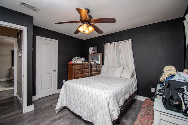 bedroom with ceiling fan and dark hardwood / wood-style flooring