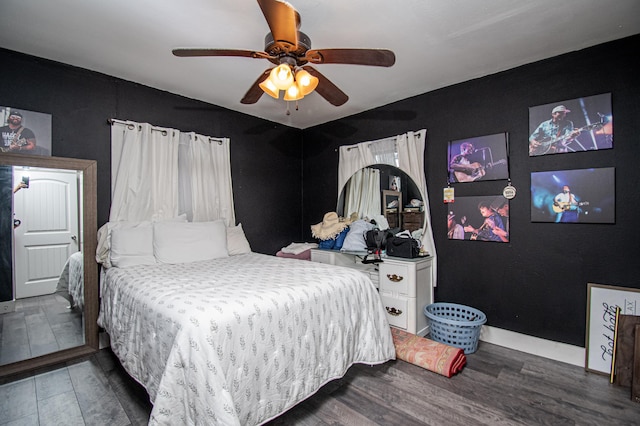 bedroom featuring dark wood-type flooring and ceiling fan