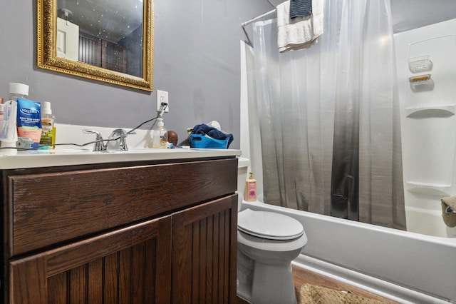 full bathroom featuring vanity, shower / tub combo with curtain, toilet, and wood finished floors
