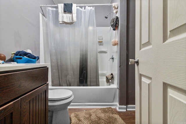 bathroom with toilet, shower / bath combo, wood finished floors, and vanity