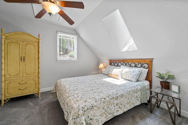 bedroom featuring lofted ceiling, baseboards, dark carpet, and a ceiling fan