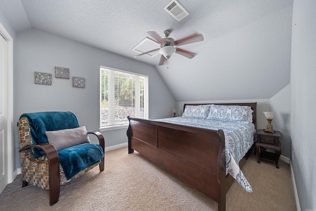 bedroom with carpet floors, visible vents, vaulted ceiling, a textured ceiling, and baseboards