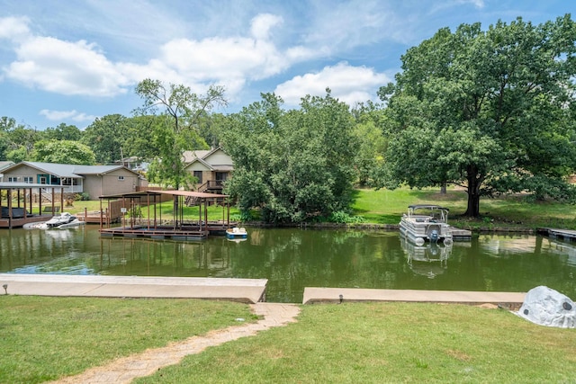 dock area featuring a water view and a yard