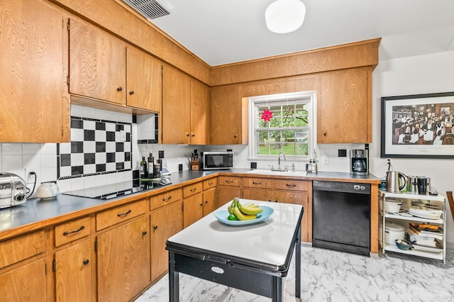 kitchen featuring tasteful backsplash, sink, and black appliances