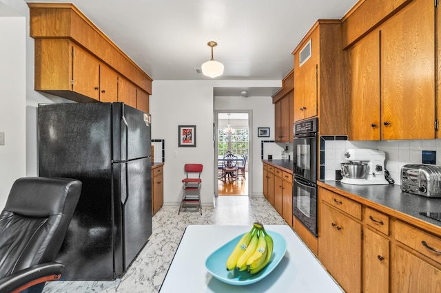 kitchen featuring tasteful backsplash and black appliances