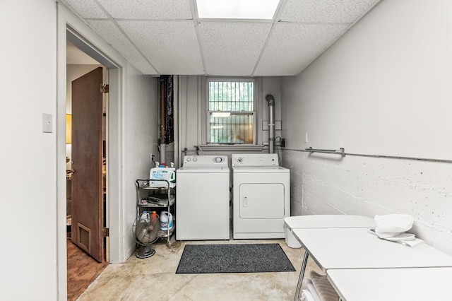 laundry room featuring washing machine and clothes dryer