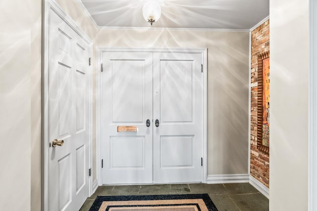 interior space with crown molding and brick wall