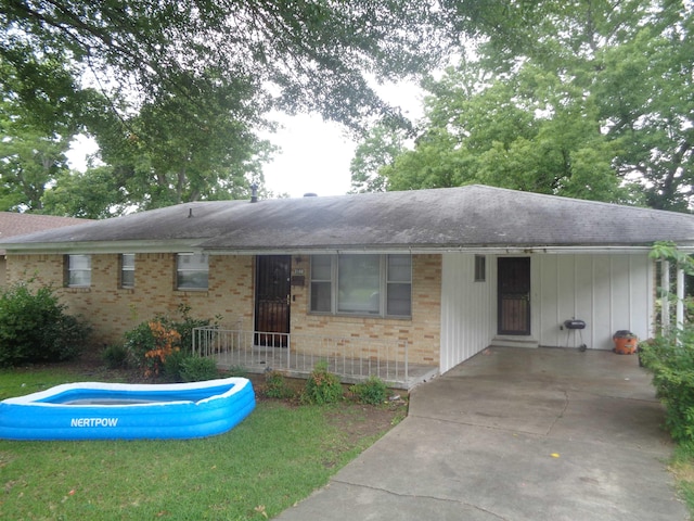 ranch-style home with a carport