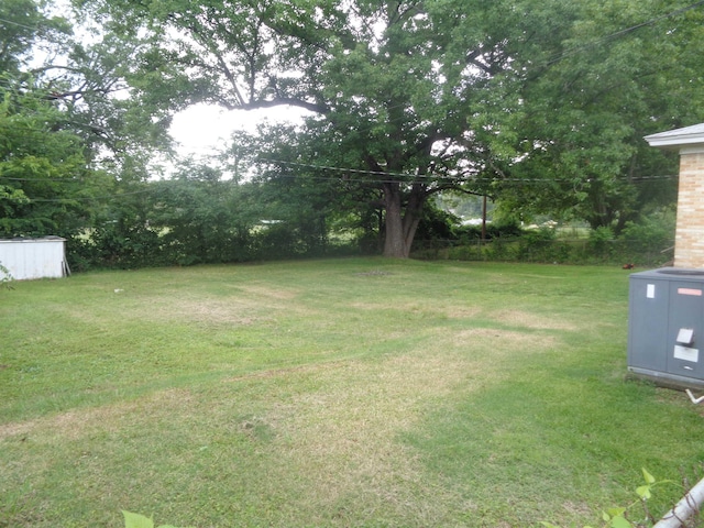 view of yard with central air condition unit