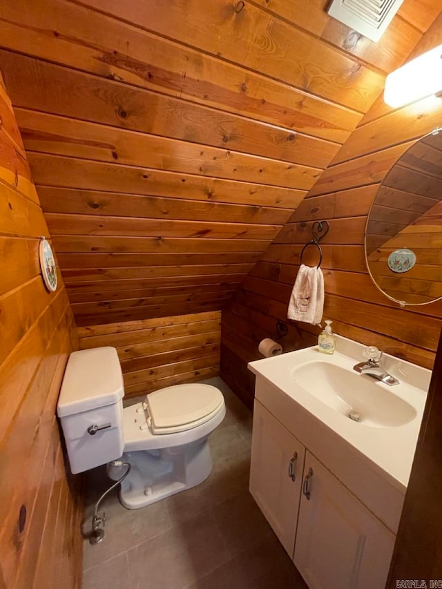 bathroom with vanity, wooden walls, toilet, lofted ceiling, and wood ceiling