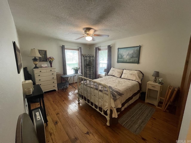 509A Woodland Hills Rd, Hardy, AR 72542 - bedroom featuring ceiling fan, hardwood / wood-style floors, and a textured ceiling