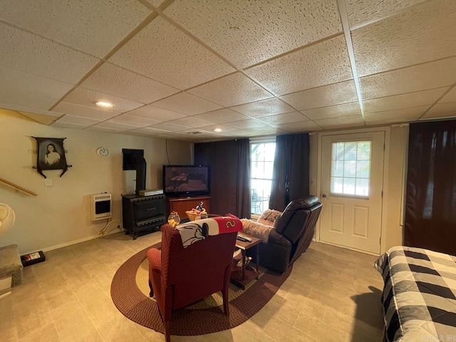 living room featuring a paneled ceiling and light tile patterned floors