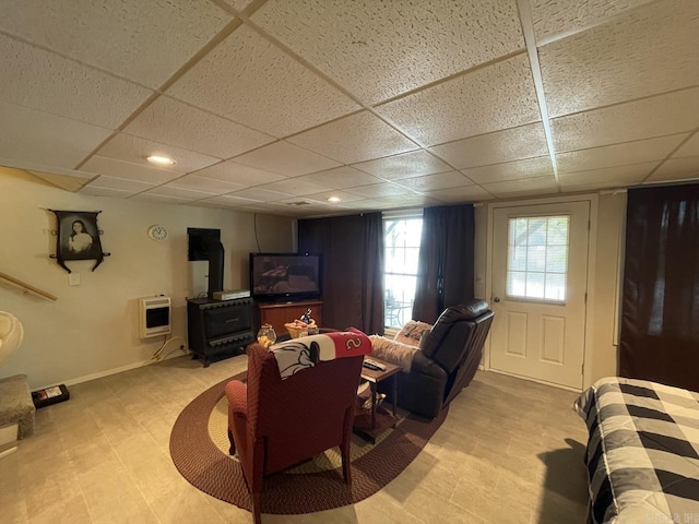 509A Woodland Hills Rd, Hardy, AR 72542 - living area with a wood stove, a paneled ceiling, baseboards, and heating unit