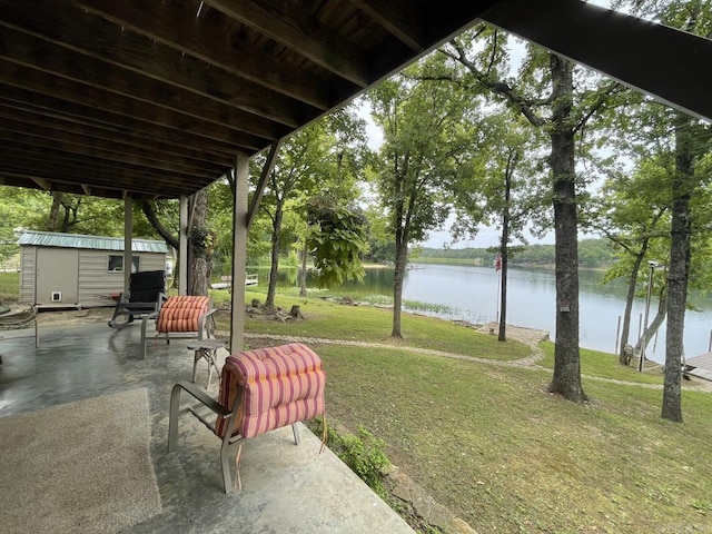 509A Woodland Hills Rd, Hardy, AR 72542 - view of yard featuring a water view, a patio, a shed, and an outdoor structure