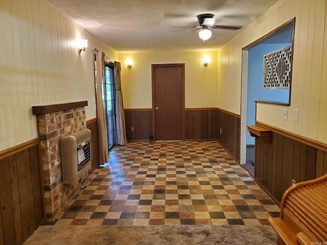 901 Hastey Ave, Mena, AR 71953 - corridor with heating unit, a wainscoted wall, and wood walls