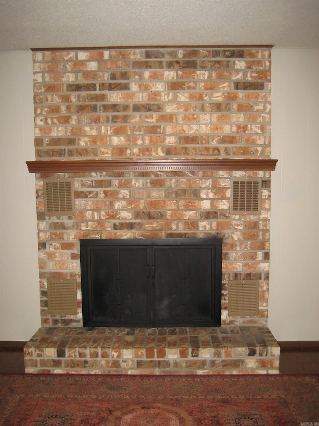 901 Hastey Ave, Mena, AR 71953 - interior details with a brick fireplace and visible vents