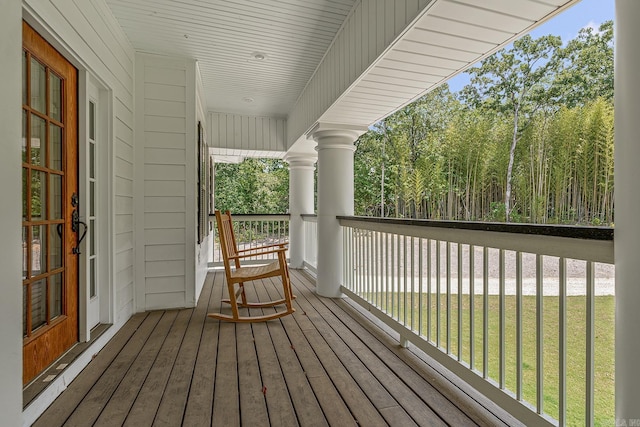 deck featuring a lawn