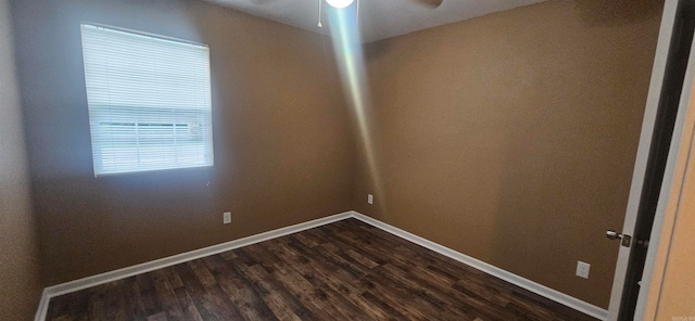 spare room featuring hardwood / wood-style flooring and ceiling fan