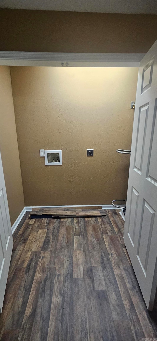 washroom with dark hardwood / wood-style flooring, hookup for an electric dryer, and washer hookup