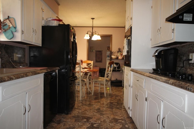 kitchen with black appliances, pendant lighting, dark tile patterned flooring, white cabinetry, and a notable chandelier