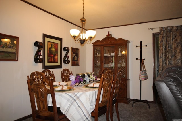 carpeted dining space with a chandelier