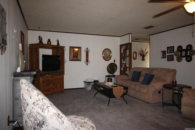 living room featuring a textured ceiling, ceiling fan, and dark carpet