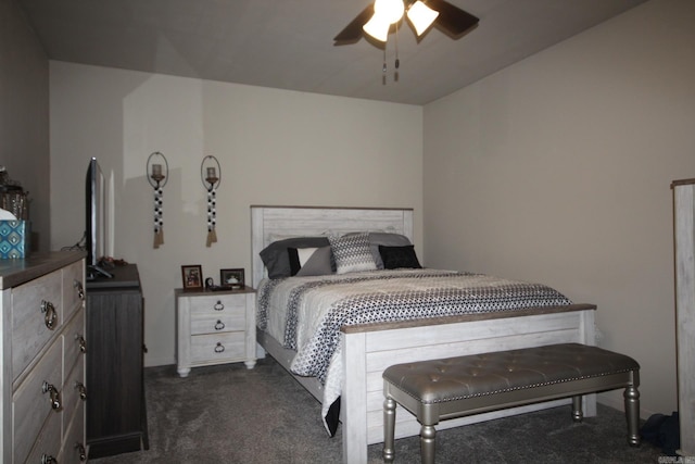 bedroom with dark colored carpet and ceiling fan