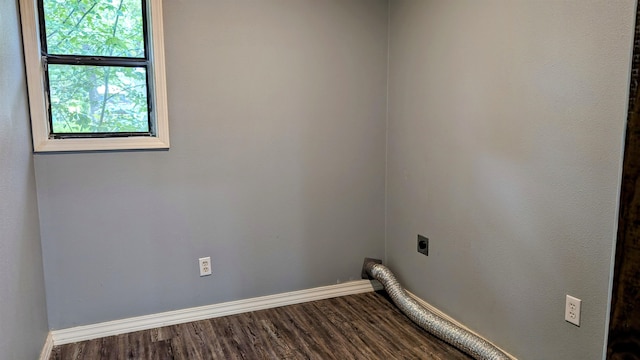 washroom with plenty of natural light, electric dryer hookup, and dark hardwood / wood-style flooring