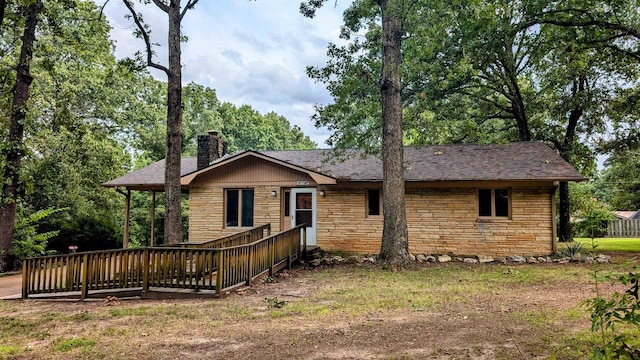 view of front of property with a wooden deck