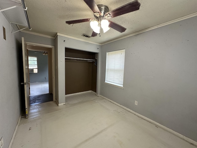 unfurnished bedroom featuring a textured ceiling, ceiling fan, ornamental molding, and a closet