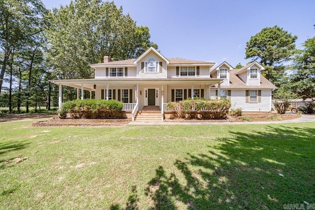 view of front of home with covered porch and a front lawn