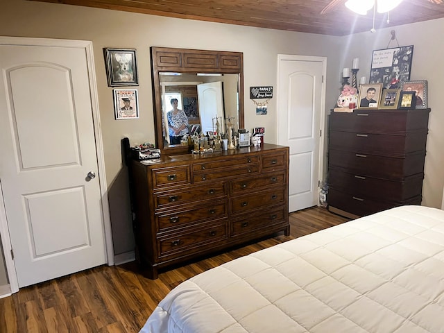 bedroom featuring ceiling fan and dark hardwood / wood-style flooring