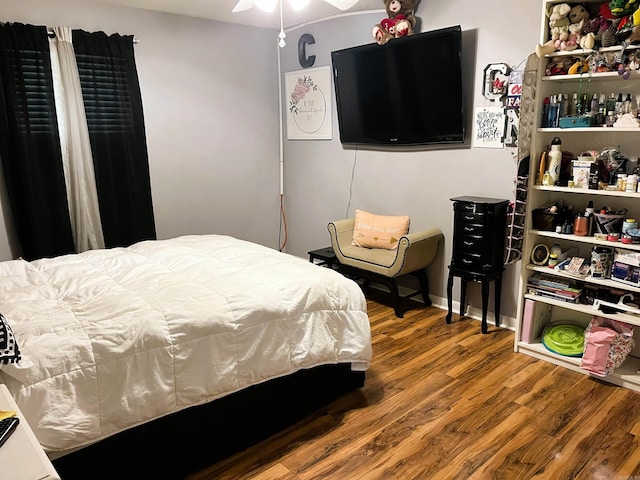 bedroom featuring ceiling fan and wood-type flooring