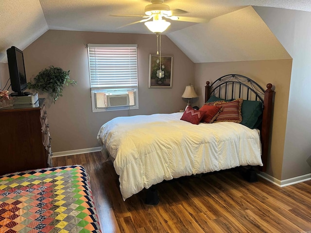 bedroom with a textured ceiling, ceiling fan, wood-type flooring, vaulted ceiling, and cooling unit