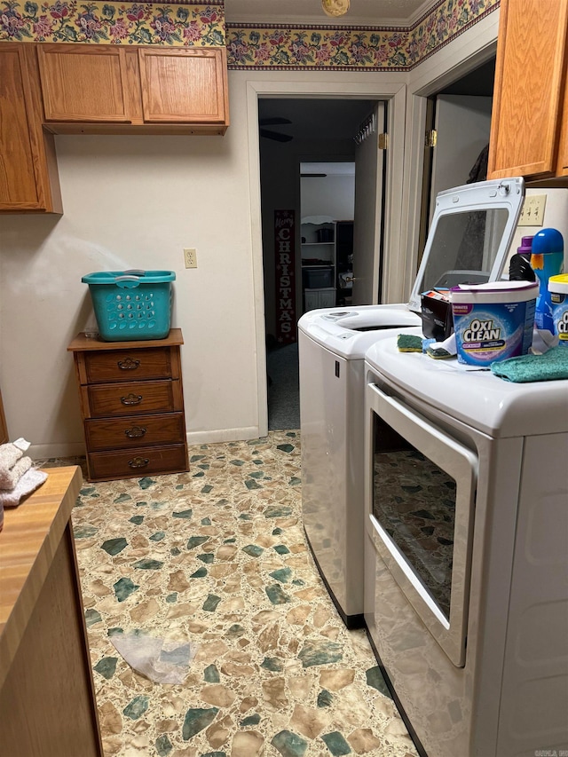 laundry area with cabinets, washer and dryer, and light tile patterned floors