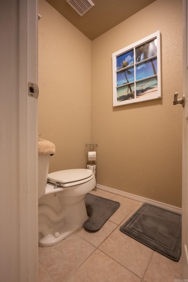 bathroom featuring toilet and tile patterned floors