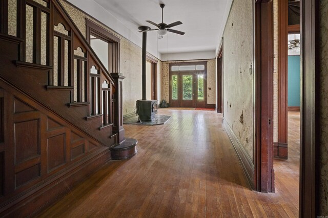 hall with hardwood / wood-style flooring and stairway