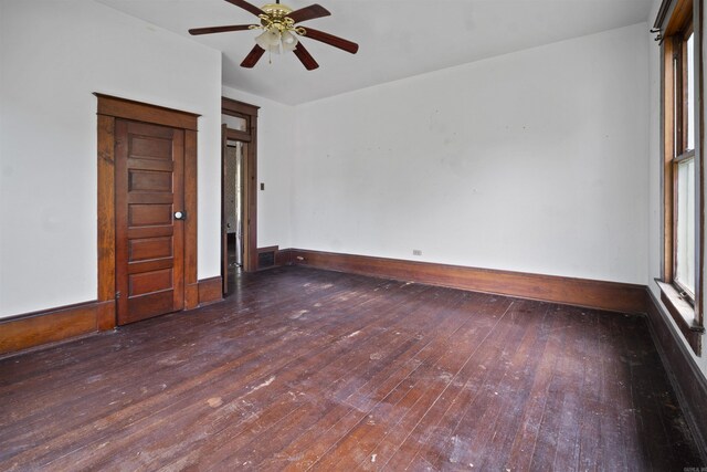 spare room with visible vents, baseboards, a ceiling fan, and wood-type flooring