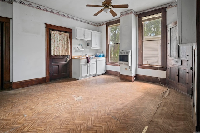 interior space featuring light parquet flooring and ceiling fan