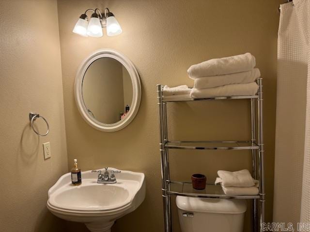 bathroom with toilet and sink